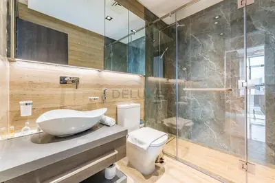 a bathroom with a sink and a toilet and a shower at Perfectly Positioned Near Dubai Miracle Garden and Butterfly Garden, Quick Drive to Global Village, Adhara Star, Arjan by Deluxe Holiday Homes in Dubai