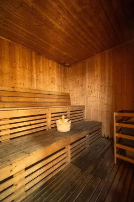 a large wooden sauna with a basket in it at Waves - Nature-Inspired Studio - JLT Skyline Living in Dubai