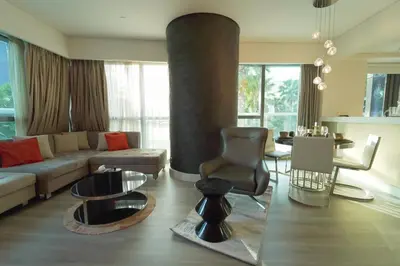 a living room with a couch and a table at Stylish 2BR Paramount Tower D in Dubai