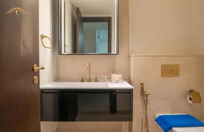 a bathroom with a sink and a mirror at New Arabian Palm Hills 6BR & Maid & Private Pool in Dubai