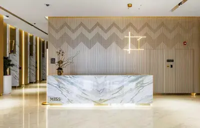 a lobby with a marble table in the middle of a room at Stylish Missoni Studio With Direct Pool Access in Dubai