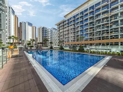 a large swimming pool in the middle of a building at Bright & Stylish Home in the Heart of Meydan in Dubai