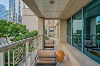 a balcony with two chairs and a table at GuestReady - Downtown stay | 29 Boulevard in Dubai
