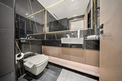 a bathroom with a toilet and a sink at FIRST CLASS 1BR Urban Living Comfort in Dubai