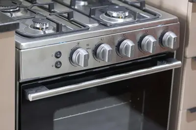 a stove top oven in a kitchen at Stylish Silicon Oasis Studio Near Mall & Airport in Dubai