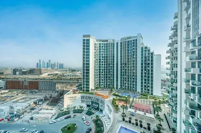 an aerial view of a city with tall buildings at Livin' Holidays -Studio - Azizi Magnificent Studio in Dubai