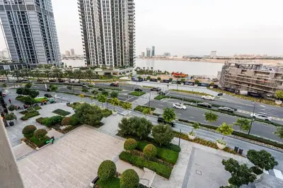an aerial view of a park in a city at 1BR Lake & Harbour View Dubai Creek Harbour in Dubai