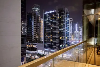 a view of a city at night from a building at Bright 2 BHK in Prime Location in Dubai