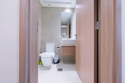 a bathroom with a white toilet and a sink at Premium Studio near Meydan Azizi Riviera 46 in Dubai