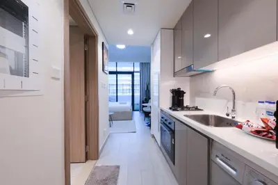 a kitchen with a sink and a counter top at Premium Studio near Meydan Azizi Riviera 46 in Dubai