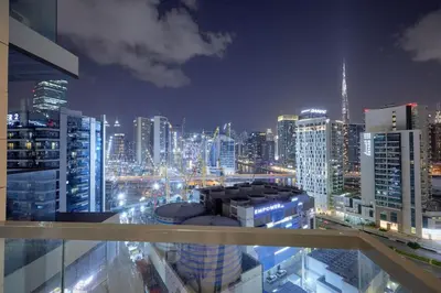 a view of a city skyline at night at Bright 1 BHK in Prime Location in Dubai