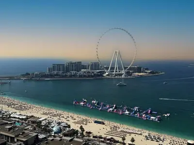 an aerial view of a beach with a ferris wheel at Dubai Short Stay Vacation Homes Rental Room in Dubai