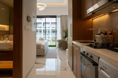 a kitchen with a sink and a stove at Airstay - Chic Studio in Meydan Azizi 65 - Monthly Offer Available in Dubai