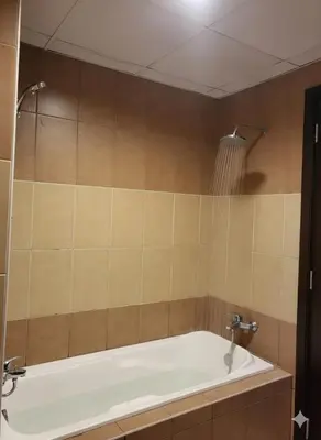 a bathroom with a bath tub in a room at Luxury 2BR with Maid Burj Khalifa and Canal View in Dubai