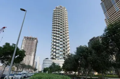 a tall building in the middle of a city at Binghatti Royale Luxe 1BR Serenity with Private Pool! in Dubai