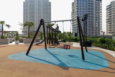 an empty playground in a city with tall buildings at Binghatti Royale Luxe 1BR Serenity with Private Pool! in Dubai