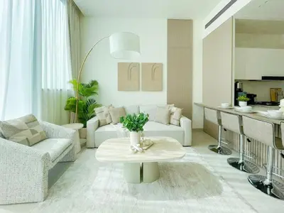 a living room with a couch and a table at Calm Luxe 1BR Suite in Binghatti Royale with Parking! in Dubai
