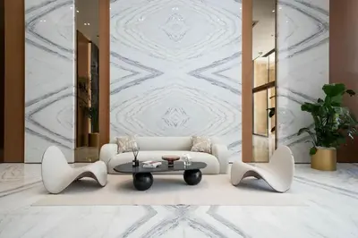 a living room with a white couch and a table at Binghatti Azure Ethereal Studio Haven with Pool & Gym! in Dubai