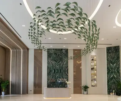 a large chandelier in a hotel lobby with plants at Binghatti Phantom's Elegant 1BR with Private Pool! in Dubai