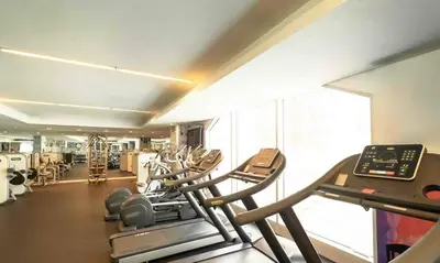 a gym with several treadmills and a large window at Dubai Marina Penthouse Suite - Prime Location in Dubai