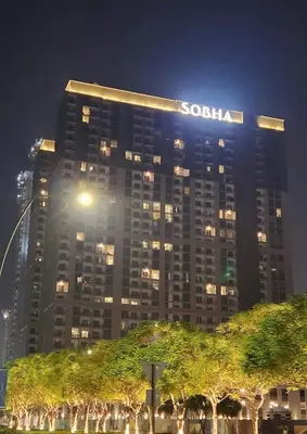 a sony building with a sign on it at night at Sohba Creek Vistas Luxury 2 Bedroom with Free Parking in Downtown Dubai Near Burj Khalifa in Dubai