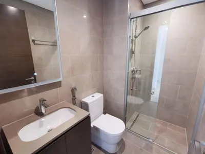 a bathroom with a toilet and a sink and a shower at Sohba Creek Vistas Luxury 2 Bedroom with Free Parking in Downtown Dubai Near Burj Khalifa in Dubai