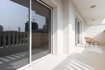 a balcony with a view of the city from a building at Relaxing 1BR Peaceful Family Living in JVC in Dubai