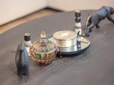 a table with a counter top with a candle and a holder at Spacious 3BR in Paramount Tower Luxury Living in Dubai