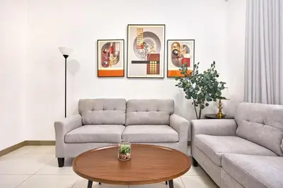 a living room with a couch and a table at Urban and Central - 1BR at Binghatti Gateway in Dubai