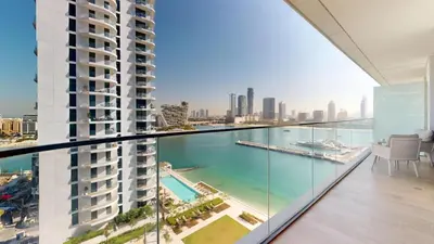 an apartment balcony with a view of the ocean at Vacationer l Classy 1 Bedroom l Yacht Views l Private Beach in Dubai