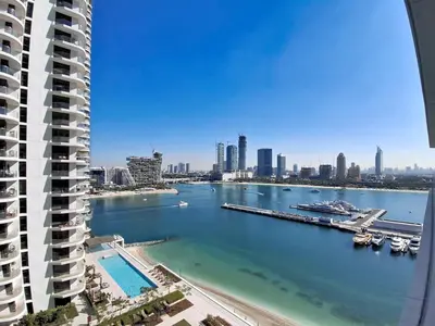 a view of the ocean from the balcony of a building at Vacationer l Classy 1 Bedroom l Yacht Views l Private Beach in Dubai