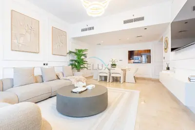 a living room with a couch and a table at Marina Canal View Apartment, Walking Distance to The Metro and Tram, Near The Beach and Top Dining - Bayside Residence, Dubai Marina by Deluxe Holiday Homes in Dubai