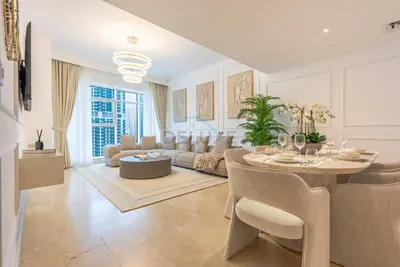 a living room with a table and a couch at Marina Canal View Apartment, Walking Distance to The Metro and Tram, Near The Beach and Top Dining - Bayside Residence, Dubai Marina by Deluxe Holiday Homes in Dubai