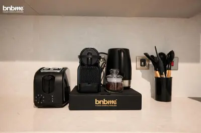 a blender sitting on top of a counter at bnbmehomes - Tiara Residence in Dubai