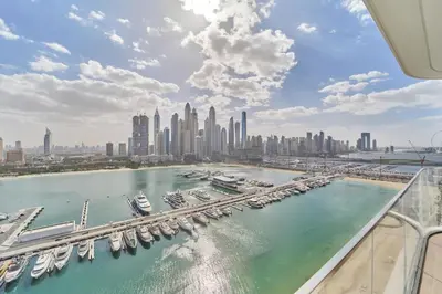 an aerial view of a harbor with boats in the water at Elegant Beachfront 2BR at Palace Beach Residence in Dubai