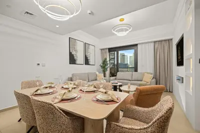 a dining room with a table and chairs at Stunning 2BR with Full Burj View in the Opera District in Dubai