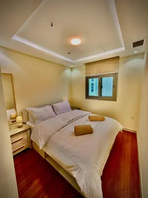 a bedroom with a large bed and a window at The Urban Retreat in Dubai