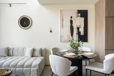 a living room with a couch and a table at GuestReady | Stylish 1BR Penthouse Retreat in Dubai