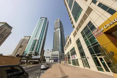 a street in a city with tall buildings at VayK - Amazing 1BR in Marina with Sea View in Dubai