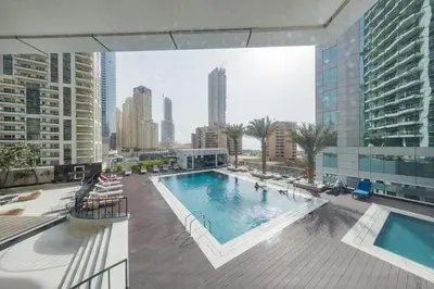 a swimming pool on the roof of a building at VayK - Amazing 1BR in Marina with Sea View in Dubai