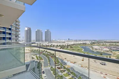 a view of a city from the balcony of a building at VayK - Chic Hotel Style Studio in Damac Hills in Dubai