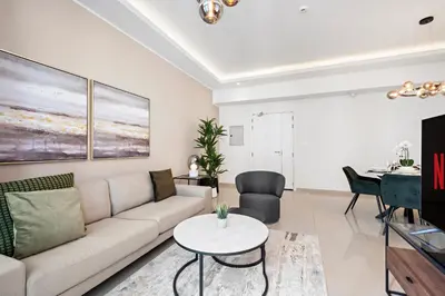 a living room with a couch and a table at VayK - Renovated 1BR in Dubai Marina in Dubai