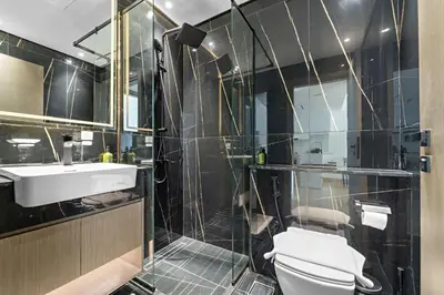 a bathroom with a toilet and a sink and a shower at VayK - Amazing 1BR in Jvc in Dubai