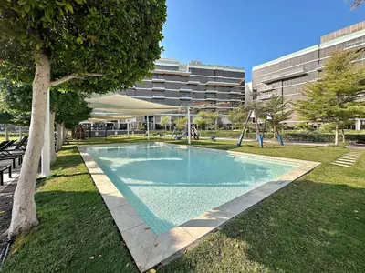 a swimming pool in a park with a playground at Upscale 1BR with Beach Access on Palm Jumeirah in Dubai