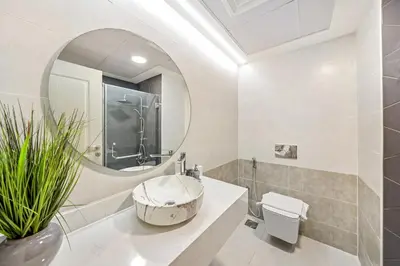a bathroom with a sink and a mirror at VayK - Contemporary 2BR in Dubai Marina in Dubai