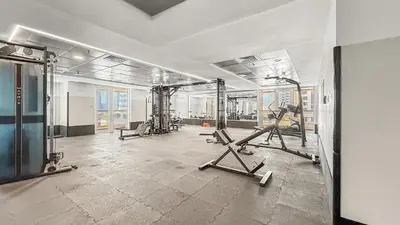 a gym with treadmills and machines in a room at VayK - Contemporary 2BR in Dubai Marina in Dubai