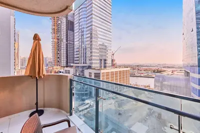 a balcony with a view of a city at Home Away 2BR in Dubai