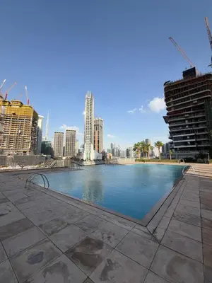 a swimming pool in the middle of a city at Prime location cozy apartment in Dubai