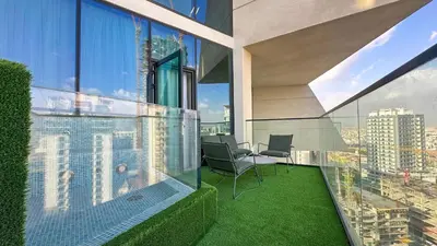 an office with a view of a city at AWS Holiday Homes - Stay in Style in Dubai