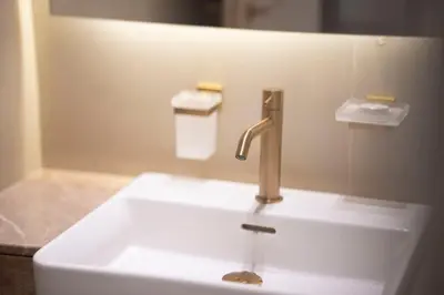 a sink with a faucet in a bathroom at AWS Holiday Homes - Stay in Style in Dubai